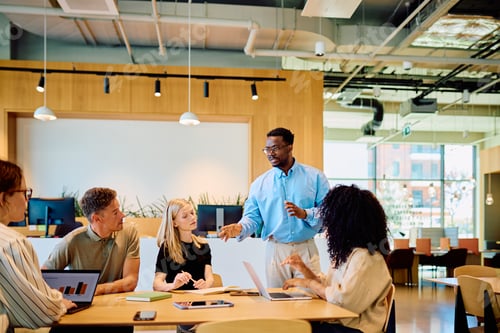 Preview: Business meeting diverse employees collaborating on startup strategy