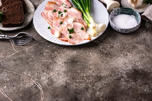 Preview: Rustic Serving of Sliced Smoked Bacon with Scallions and Rye Bread