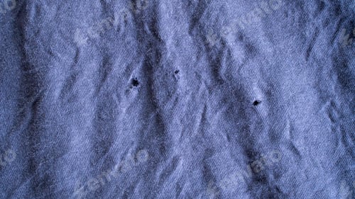 Preview: Worn out purple fabric texture with small holes and heavy wrinkles showing aged textile material for