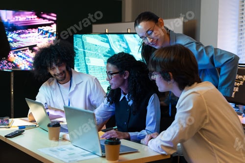 Tech Team Collaborating on Software Development in Modern Office