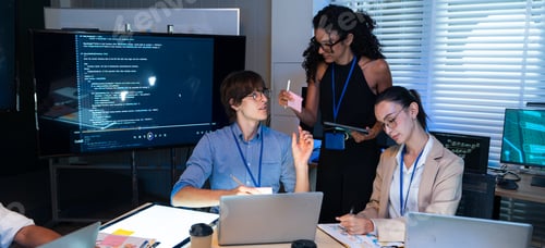 Preview: Tech team analyze computer software code on screen