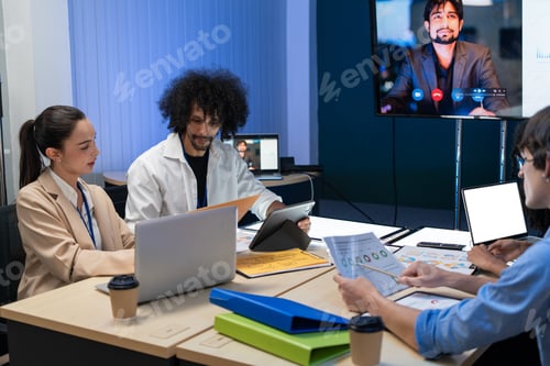 Preview: Colleagues analyzing AGI business during a meeting