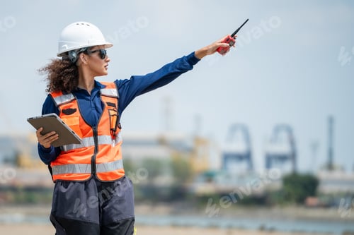 Preview: Engineer woman pointing toward cargo freight