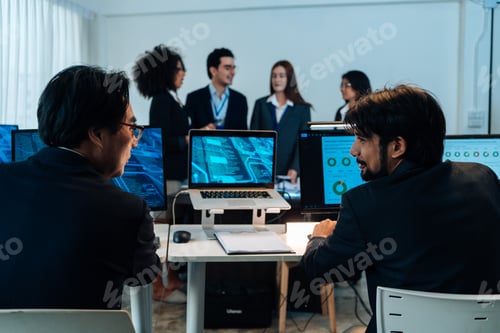 Preview: Developers discussing coding project at the office