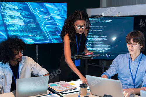 Preview: Tech team analyze computer software code data on screen