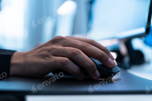 Preview: Close-up of a hand using a wireless computer mouse