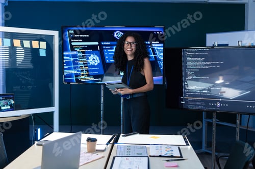 Preview: Female programmer explaining code on the screen at the meeting
