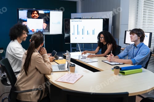 Preview: Business team in the office analyzing AGI financial trends on screens