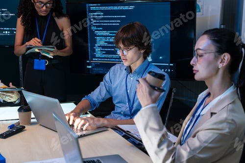 Preview: Developer team making application and reviewing the result at the office