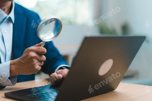Preview: Business using magnifying glass searching online