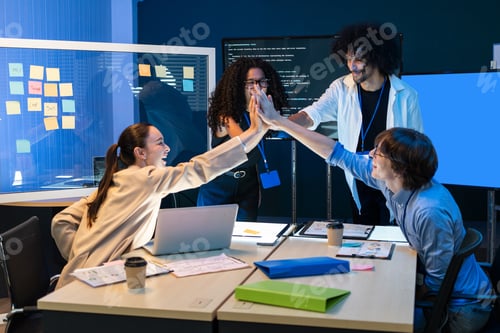 Preview: Business team high five for celebrating success project at the office