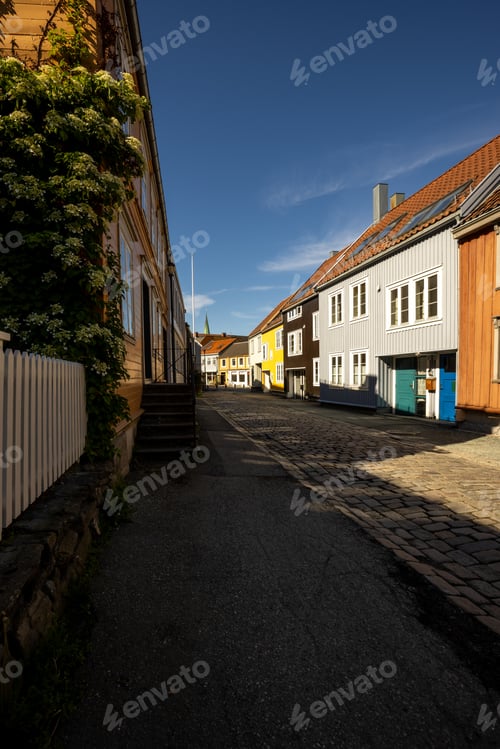 Preview: Quiet Cobblestone Street with Colorful Wooden Buildings