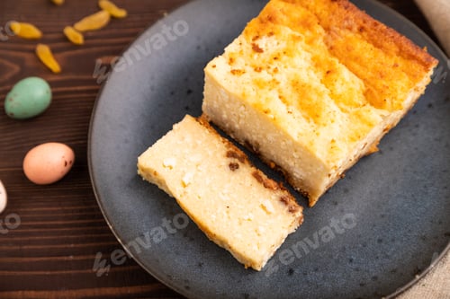 Preview: Сottage cheese Сasserole, Curd cake, with dried apricots and raisins on brown wooden, side view, sel