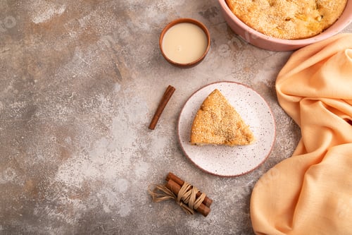 Preview: Apple Charlotte cake on brown concrete, top view, flat lay, copy space