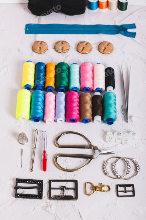Preview: Accessories and tools for sewing and handicrafts on the work table vertical view