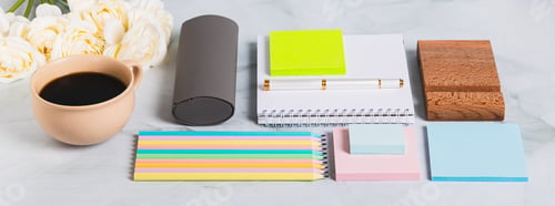 Preview: A notebook, pen, cup of coffee and stationery on a desk web banner