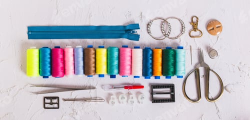 Preview: Accessories and tools for sewing and handicrafts on the work table top view web banner