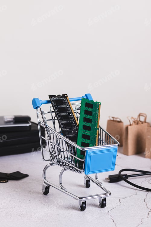 Preview: Two computer memory modules in a shopping cart on a table vertical view