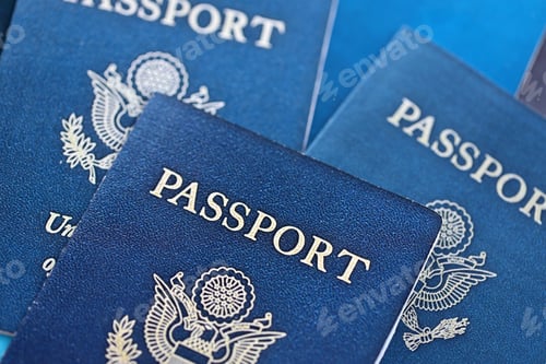 Preview: Many US passports on table. Official identification document books for citizens of United States