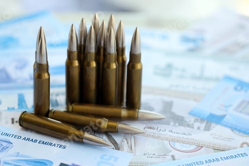 Preview: United Arab Emirates dirham currency money bills and rifle bullets. The concept of warfare and gun s