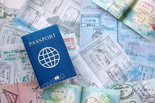 Preview: One fictional passport on big amount of passport pages full of colorful stamps after travel