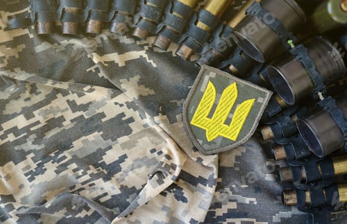 Preview: Ukrainian army symbol on machine gun belt lies on ukrainian pixeled military camouflage