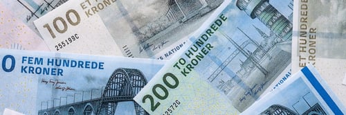 Preview: Danish krone paper banknotes pile on table. Denmark DKK currency money bills in big amount