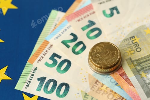 Preview: European union money currency Euro different paper notes and coins on flag