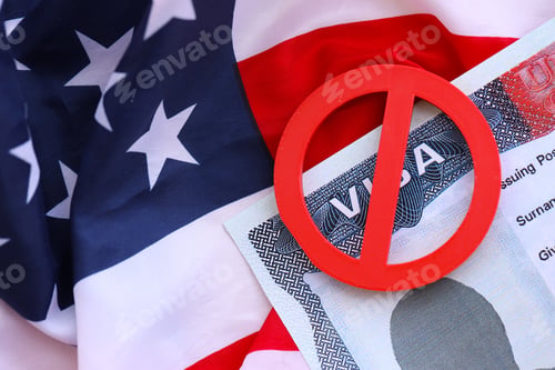 Preview: Visa Ban Concept. United States of America visa on passport page with prohibition sign