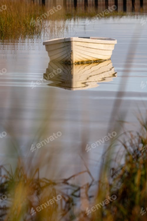Preview: Golden light on sailboat in Nantucket Island harbor