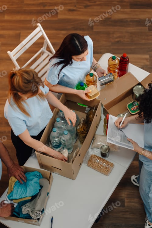 Preview: Volunteers sorting donations for community food bank