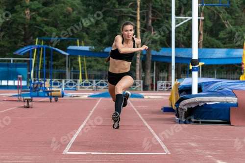 Preview: Beautiful female athlete triple jump