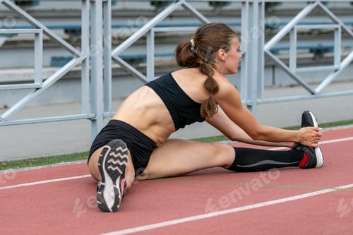 Preview: Female athlete exercises for leg flexibility