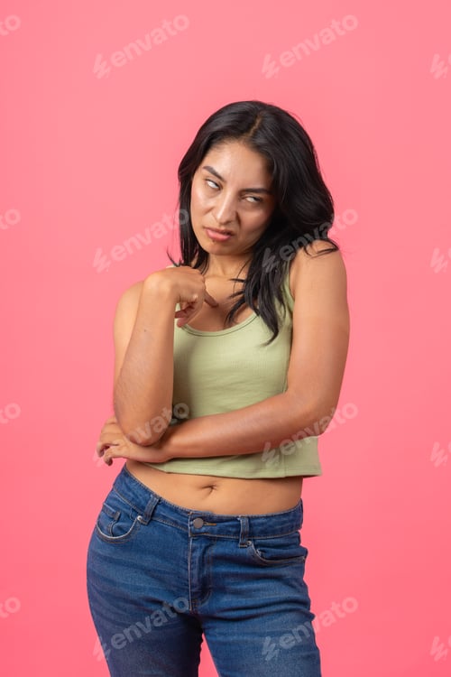 Preview: Young woman showing disgusted facial expression