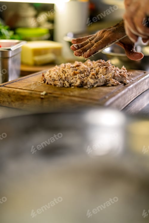 Preview: Chef hands preparing shredded chicken for pizza
