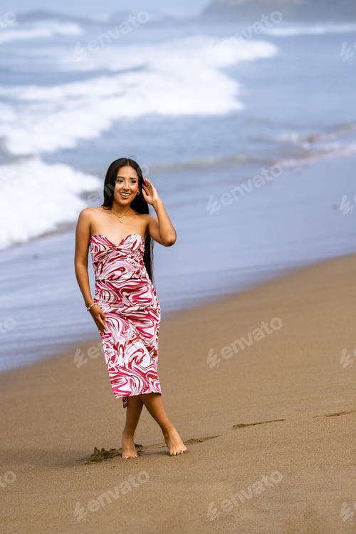 Preview: Young woman smiling, enjoying beach day with ocean waves