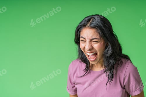 Preview: Young woman intensely screaming with wide open mouth