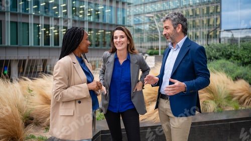Preview: Diverse business people brainstorming ideas during outdoor meeting