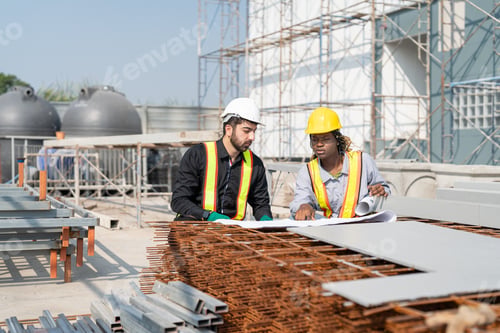 Preview: Engineer and architect inspect steel reinforcement at building site