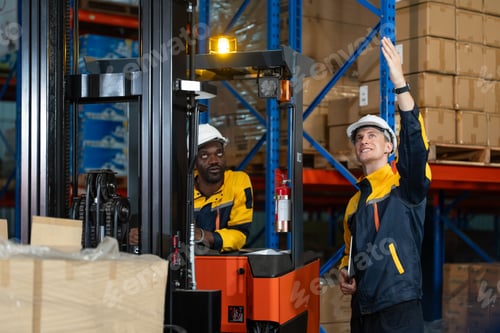 Preview: Forklift driver discusses warehouse stock with colleague using tablet