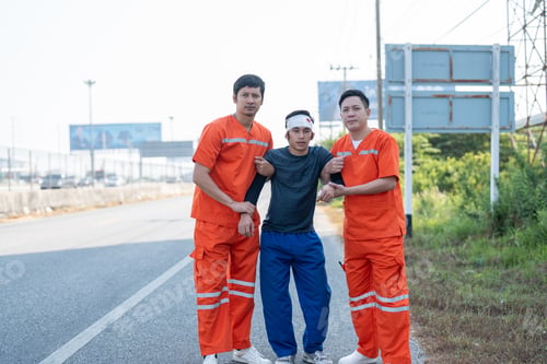 Preview: Asian male ems paramedics orange uniforms moving patient to ambulance from road accident