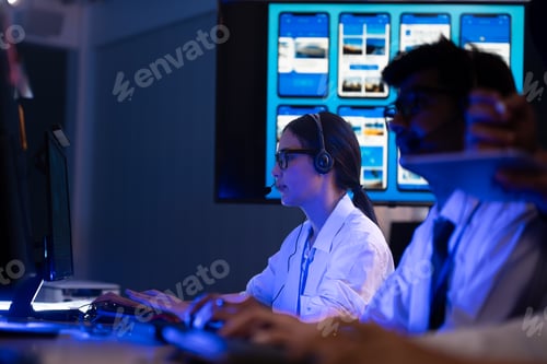 Preview: Customer service team monitors computers in night control room