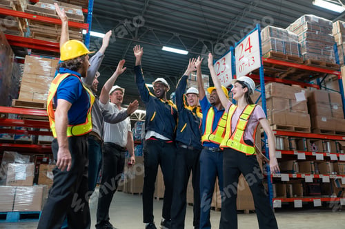 Preview: Warehouse workers celebrate teamwork success in factory store