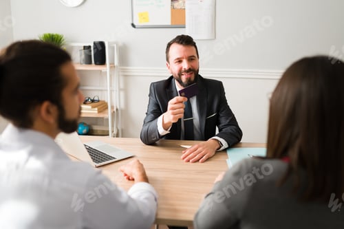 Preview: Finance advisor talking with a young couple