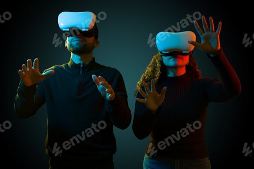 Preview: Young woman and man enjoying a virtual reality game