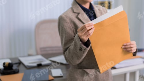 Preview: Asian adult business women lawyer reading legal document paper contract corporate office professiona