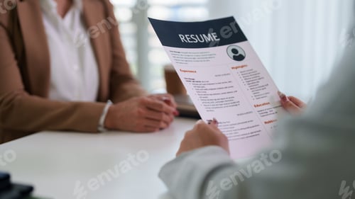 Preview: Professional Adult Women Job Interview Hiring Manager Reviewing Candidate Resume Document Applicatio