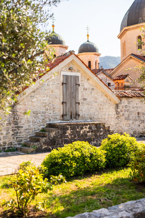 Preview: Stone house with wooden door in the old town of Kotor Montenegro near historic fortress walls