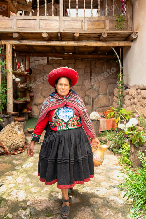 Preview: Indigenous Andean woman walking in rustic courtyard wearing traditional clothing