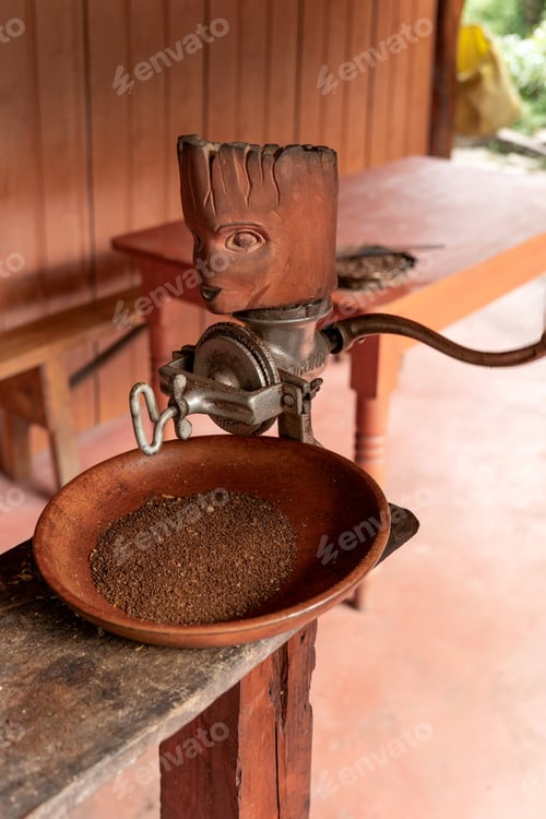 Preview: Wooden hand coffee grinder preparing fresh ground coffee